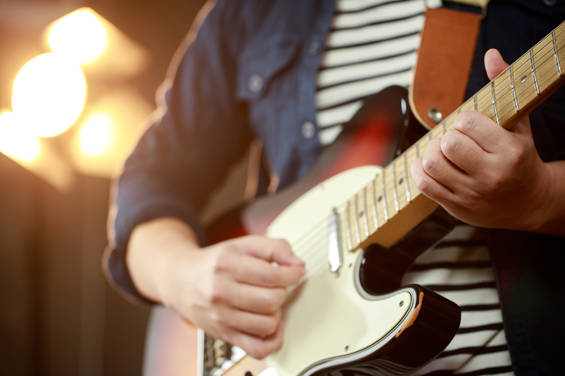 Person Playing Electric Guitar   